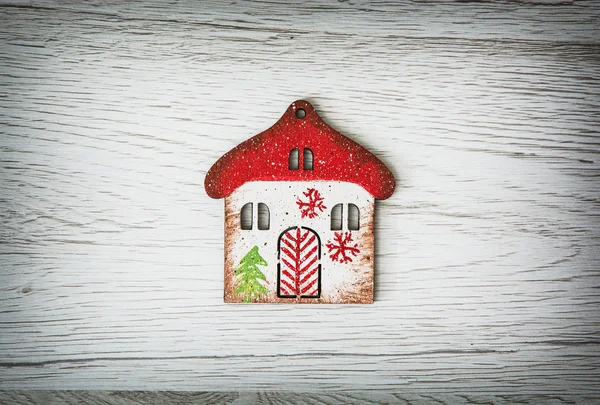 Little decorative house on the wooden background — Stock Photo, Image