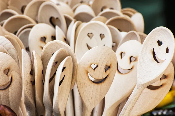 Carved wooden spoons, iconic faces — Stock Photo, Image