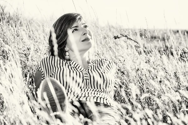 Natural lovely woman posing in the summer meadow, colorless — Stock Photo, Image