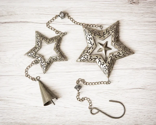 Metallic hanging stars and bell, Christmas decoration — Stock Photo, Image