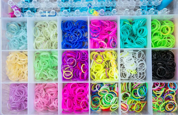 Box with colorful rubber bands for rainbow loom — Stock Photo, Image