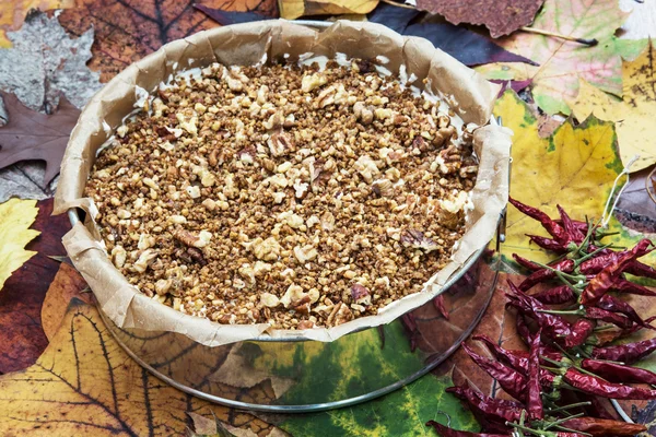 Creamy caramel cake with pecan nuts and chili peppers — Stock Photo, Image