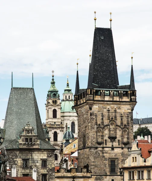 Town bridge tower and Saint Nicholas church in Prague — Stock Photo, Image