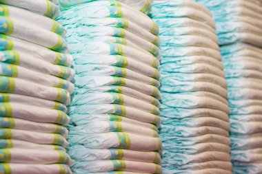 Children's diapers stacked in a piles clipart