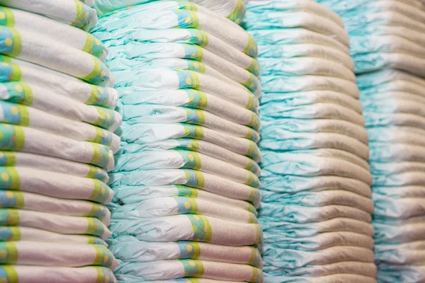 Children's diapers stacked in a piles — Stock Photo, Image