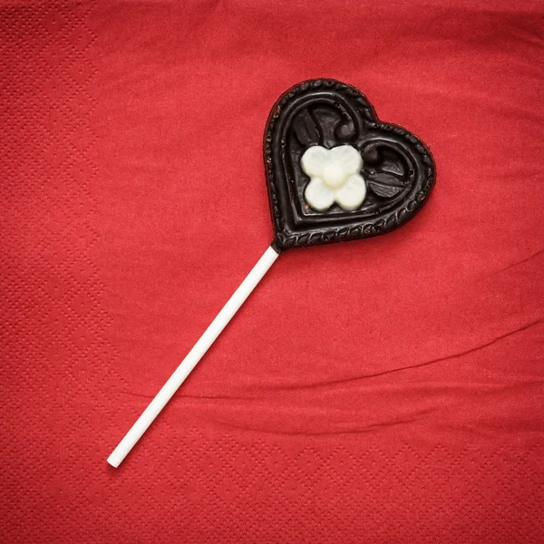 Chocolate heart-shaped lollipop — Stock Photo, Image