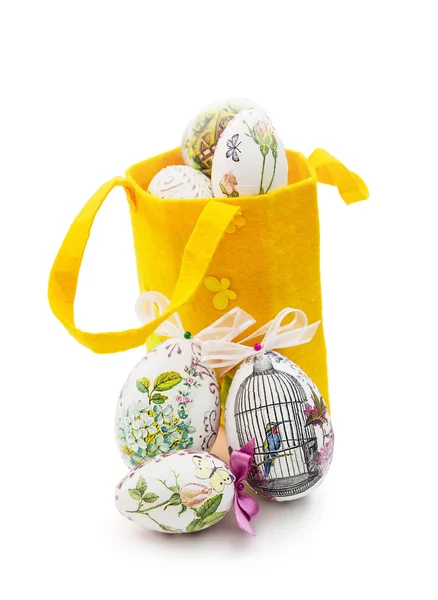 Decorated Easter eggs and yellow basket — Stock Photo, Image