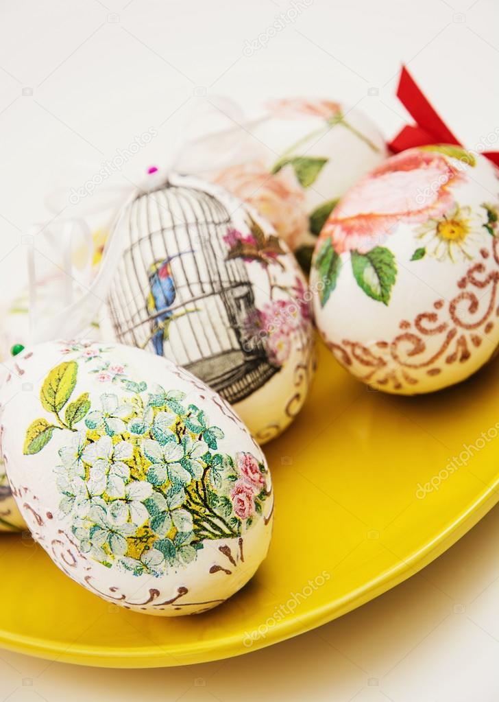 Decorated Easter eggs on the yellow plate