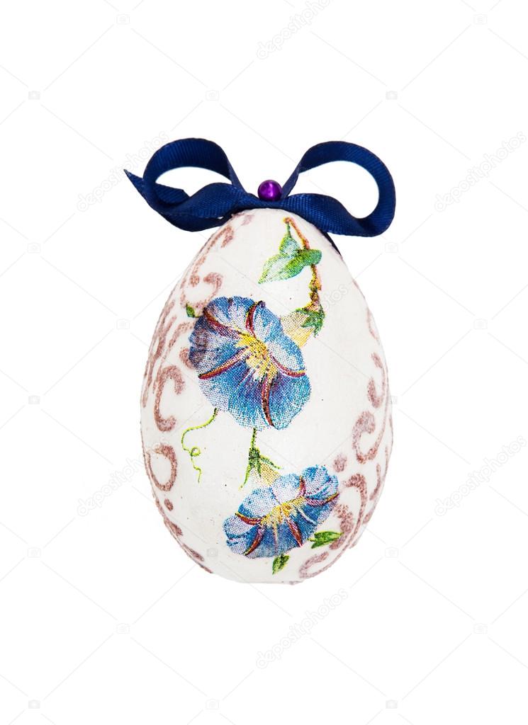 Beautiful painted Easter egg with blue bow