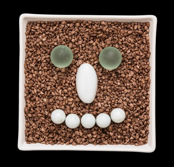 Pedras decorativas na forma de rosto sorriso — Fotografia de Stock