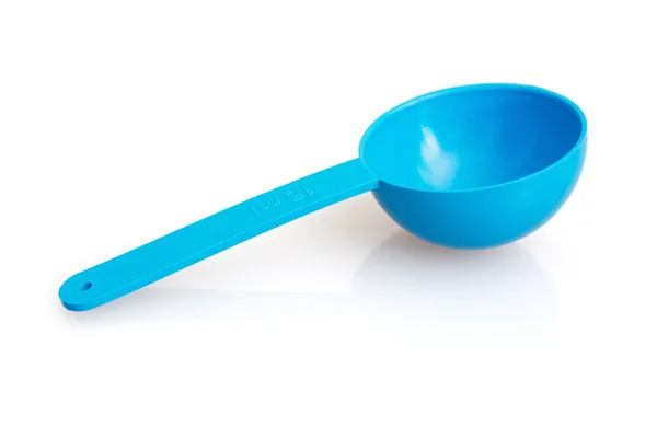 Blue plastic ladle with reflection — Stock Photo, Image