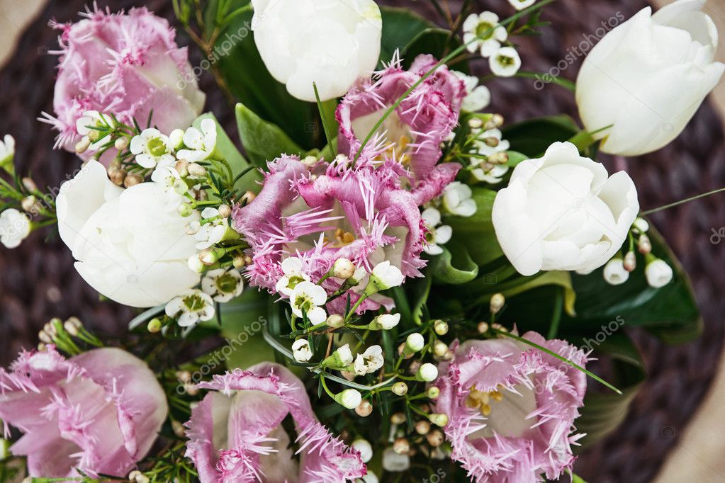 Bouquet of beautiful white and purple tulips