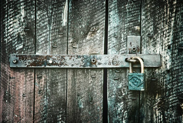 Locked wooden doors close up, retro style — Stock Photo, Image