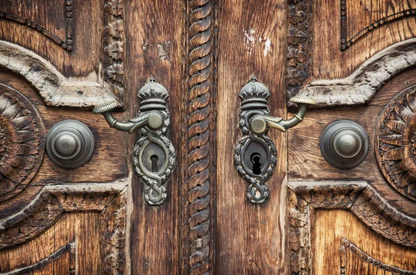 Old wooden hand-carved door — Stock Photo, Image