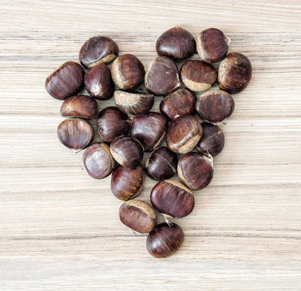 Chestnuts in the heart shape, Valentine's day — Stock Photo, Image