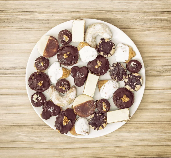 Delicate festive cookies on the white plate — Stock Photo, Image