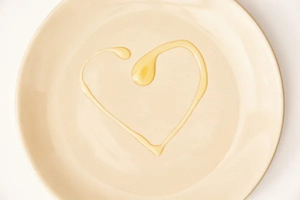Honing in de vorm van hart op de plaat, Valentine's day — Stockfoto