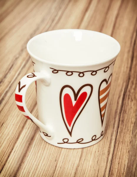 Empty cup with red retro hearts, valentine symbol — Stock Photo, Image