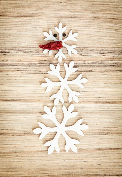 Cute snowman made of snow flakes and chili pepper, symbol of win — Stock Photo, Image