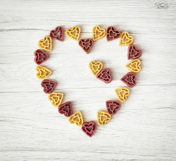 Valentine's heart made of cute pasta, Valentine's Day, food them — Stock Photo, Image