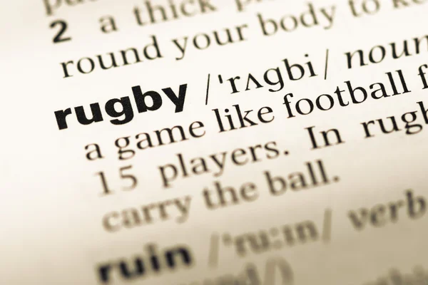 Close up van oude Dutch pagina met woord rugby — Stockfoto