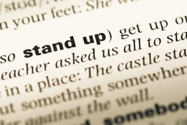 Fechar a página do dicionário de Inglês antigo com palavra stand up — Fotografia de Stock