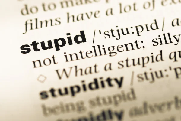 Close up of old English dictionary page with word stupid — Stock Photo, Image