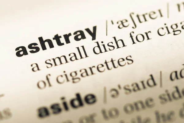 Close up of old English dictionary page with word ashtray — Stock Photo, Image