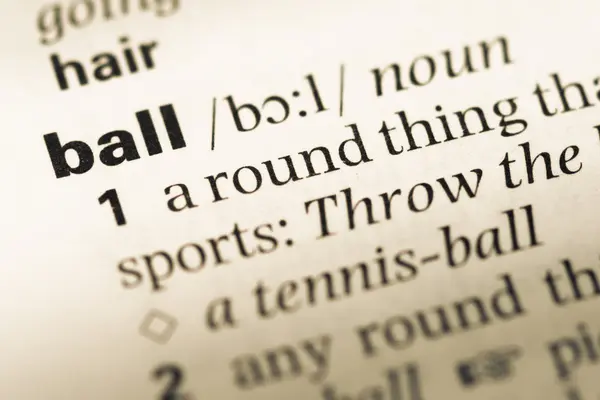 Close up of old English dictionary page with word ball — Stock Photo, Image