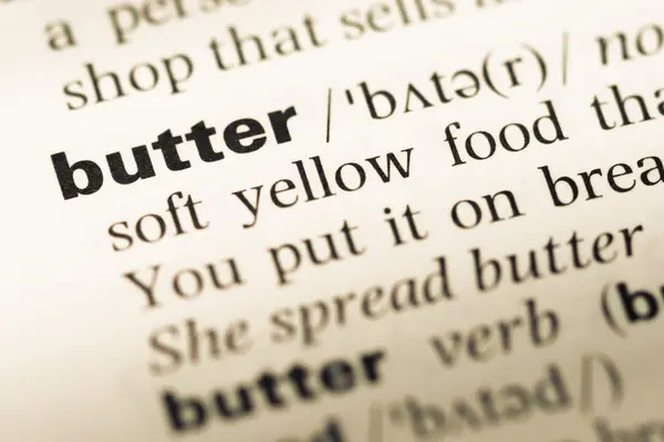 오래 된 영어 사전 페이지 단어 버터의 클로즈업 — 스톡 사진
