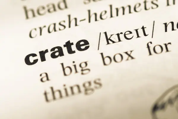 Close up of old English dictionary page with word crate — Stock Photo, Image