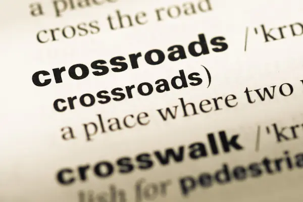 Close up of old English dictionary page with word crossroads — Stock Photo, Image