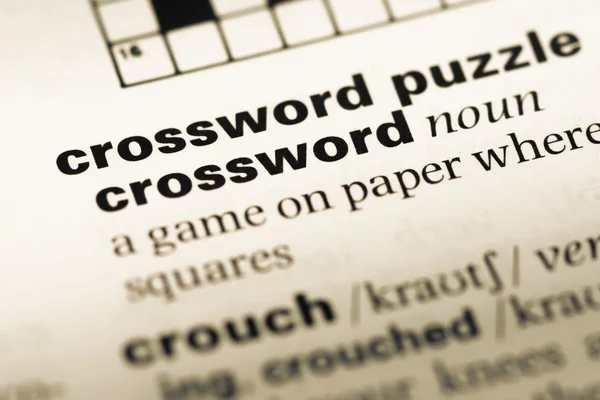 Close up of old English dictionary page with word crossword puzzle — Stock Photo, Image