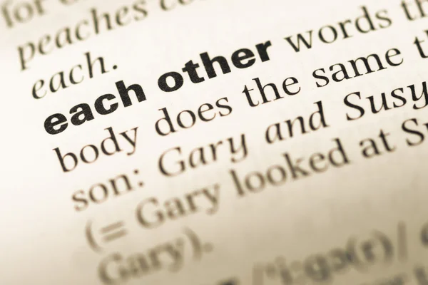 Close up of old English dictionary page with word each other — Stock Photo, Image