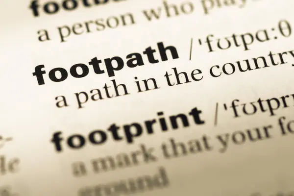 Close up of old English dictionary page with word footpath — Stock Photo, Image