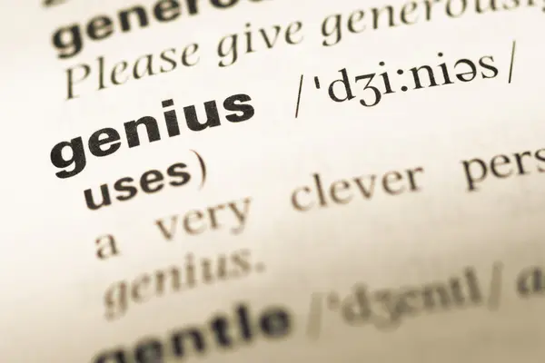 Close up of old English dictionary page with word genius — Stock Photo, Image