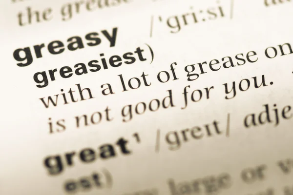 단어 greasiest와 오래 된 영어 사전 페이지 닫습니다 — 스톡 사진