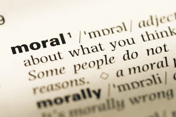 Close up of old English dictionary page with word moral — Stock Photo, Image