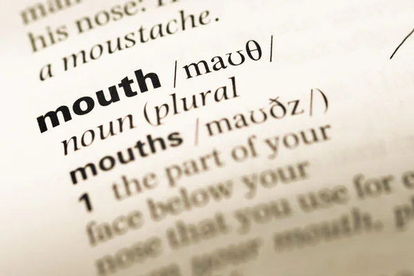 Close up of old English dictionary page with word mouth — Stock Photo, Image