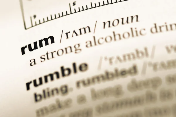 Close up of old English dictionary page with word rum — Stock Photo, Image