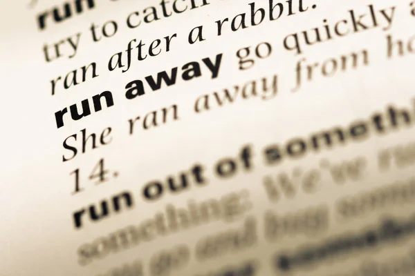 Close up of old English dictionary page with word run away — Stock Photo, Image