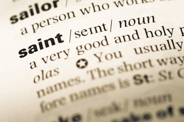 Fechar a página do dicionário de Inglês antigo com a palavra saint — Fotografia de Stock