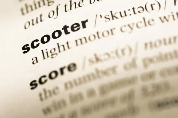 Close up of old English dictionary page with word scooter — Stock Photo, Image