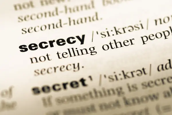 Close up of old English dictionary page with word secrecy — Stock Photo, Image