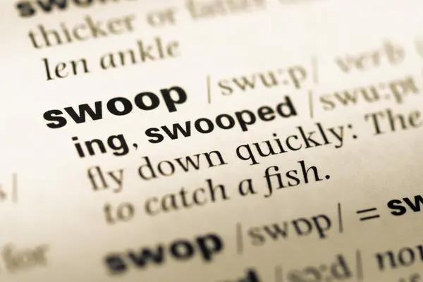 Close up of old English dictionary page with word swoop — Stock Photo, Image