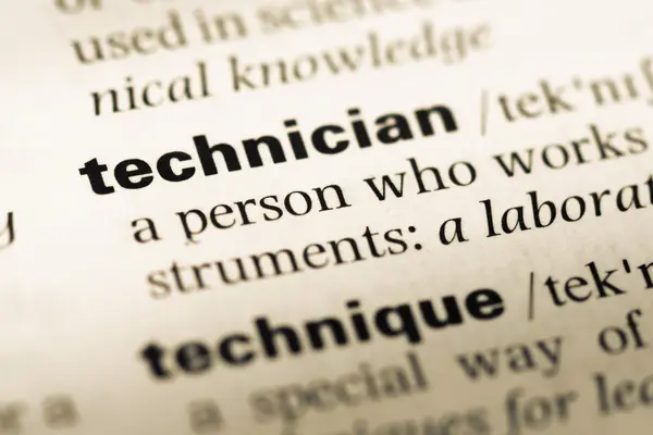 Close up of old English dictionary page with word technician — Stock Photo, Image