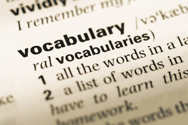 Close up of old English dictionary page with word vocabulary — Stock Photo, Image