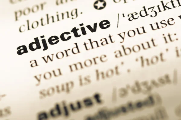 Close up of old English dictionary page with word adjective — Stock Photo, Image