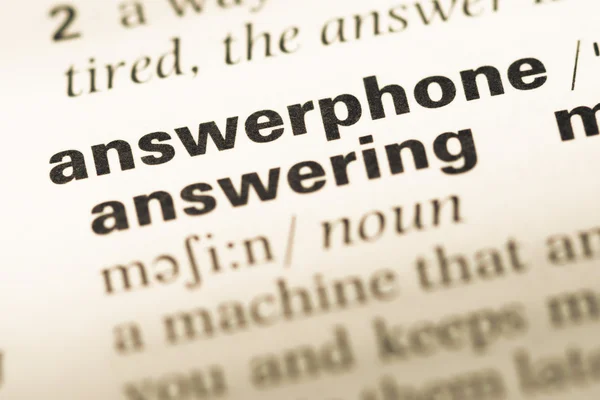 Close up of old English dictionary page with word answerphone — Stock Photo, Image