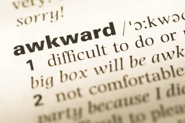 Close up of old English dictionary page with word awkward — Stock Photo, Image